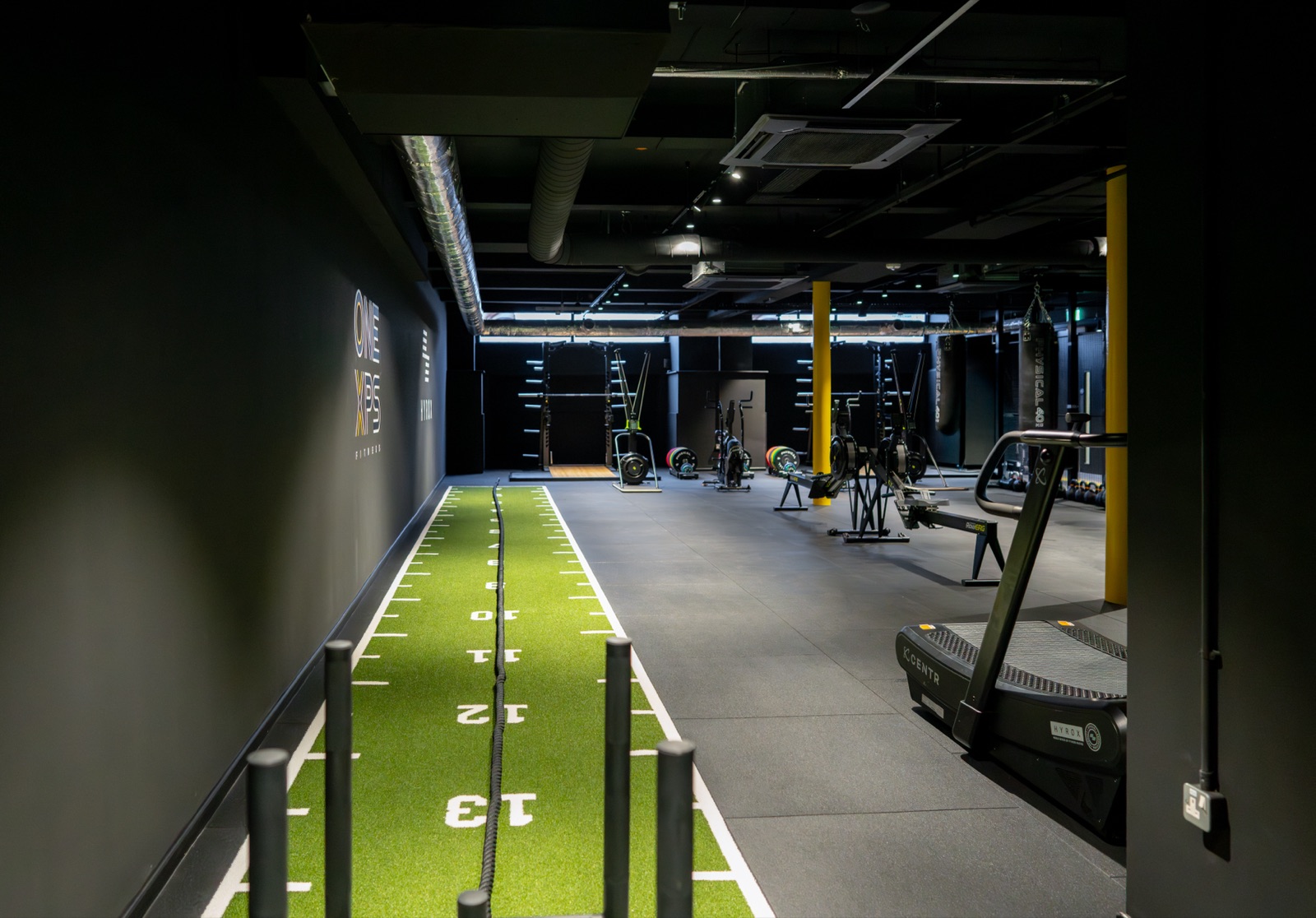 Weighted sled on the HYROX turf sprint track at the gym used by Full Motion Physio Manchester