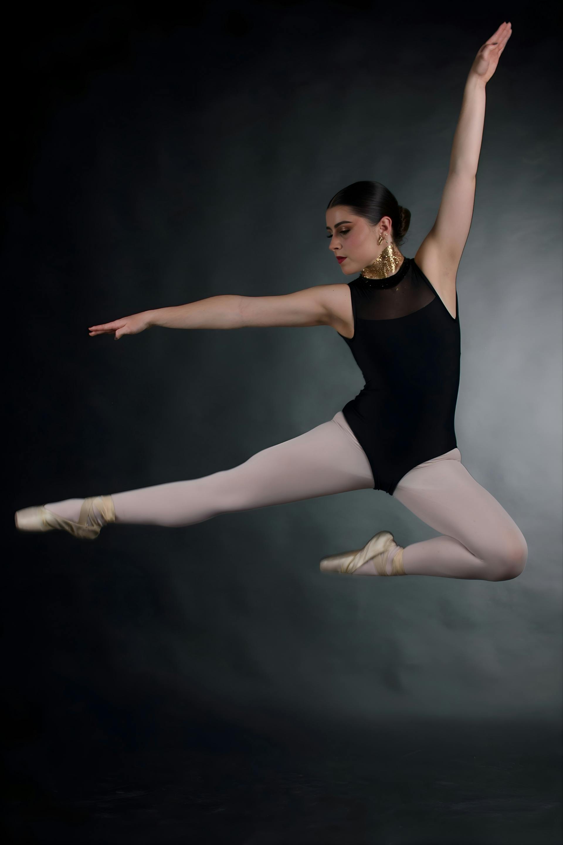 Ballet dancer captured mid-jump in performance